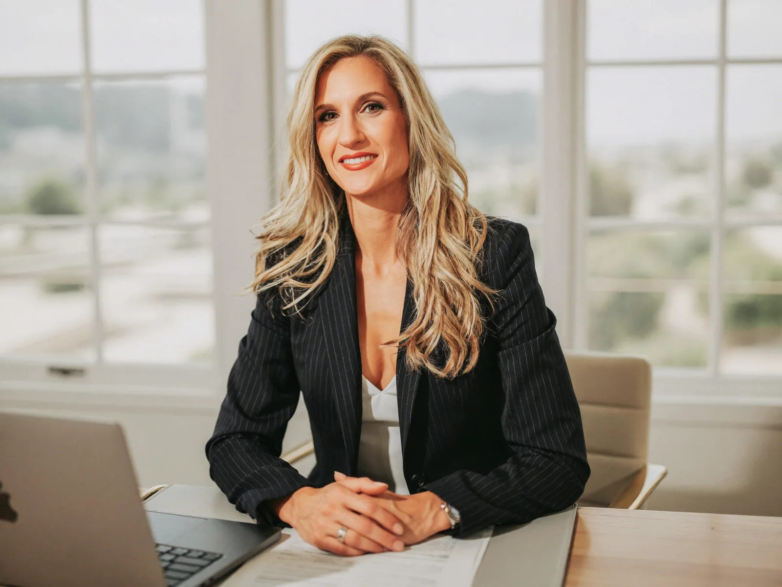 Anna Dutko, licensed Florida mortgage broker, reviewing refinance options at her Tampa office desk